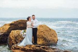 Same couple with a bride in a blue dress walk photo