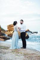 Same couple with a bride in a blue dress walk photo