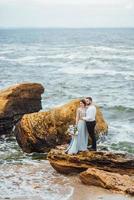 Same couple with a bride in a blue dress walk photo