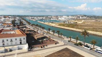 View of Bensafrim River and harbour in Lagos, Algarve, Portugal - Aerial low angle Panoramic shot video