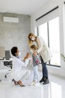 Doctor examining a child photo