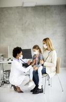 Vertical view of a pediatrician talking to a girl