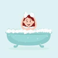 a little happy girl bathing in a bathtub with bubbles