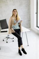 Vertical view of a businesswoman with a tablet photo