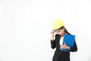 Woman in hard hat on white background photo