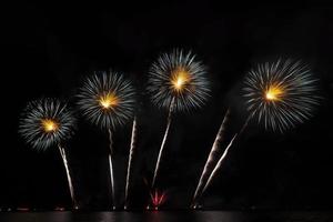 Festive beautiful colorful fireworks display on the sea beach  Amazing holiday fireworks party or any celebration event in the dark sky