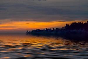 landscape from a height overlooking the sea and a bright sunset photo