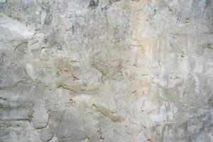 natural background from the gray plaster with a rough texture photo