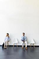 Vertical view of people seated in the  waiting room photo