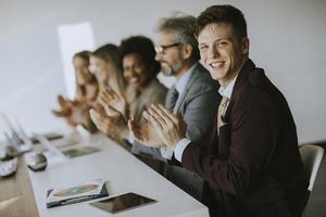 Group of business people applauding photo