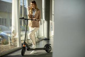 Woman with scooter in office