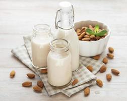 Almond milk and almonds photo