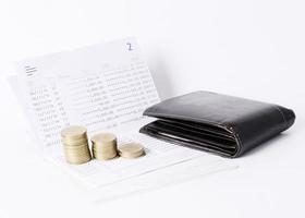 Money coin stack and wallet on book bank saving loan concept photo