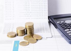 Money coins stack and calculator for business and finance concept photo