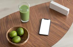 Green juice with mock up smart phone photo