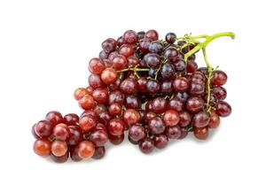 Ripe red grape bunch isolated on a white background.