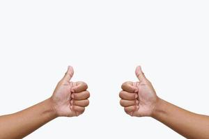 Thump up hand sign isolated on white photo