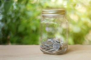 Glass jar with coins photo