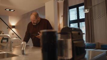 Man walking with smartphone prepares making coffee video
