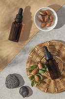 Minimal background of argan oil care composition photo