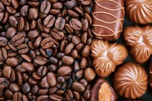 Chocolate candies and coffee beans photo