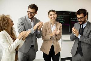 People clapping in a meeting photo