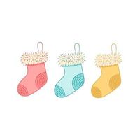 Tres calcetines navideños aislados en estilo doodle vector