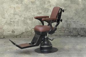 Antique black dentist leather chair with headrest
