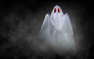 White ghost on black background photo
