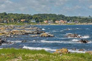 Coast line of Baltic Sea near the village of Svaneke on Island Bornholm in Denmark photo