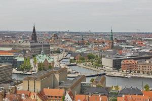 Skyline of scandinavian city of Copenhagen in Denmark during a cloudy day photo