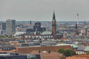 Skyline of scandinavian city of Copenhagen in Denmark during a cloudy day photo