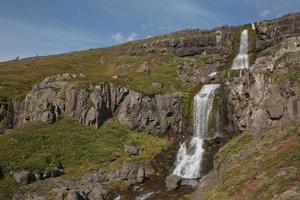 Beautiful cascade waterfall Bleiksarfoss in Eskifjordur east of Iceland