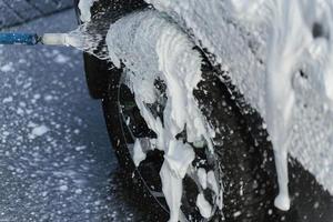 Washing the wheel of a car photo