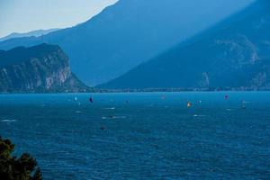 Kitesurfing in the early morning on Lake Garda at Limone sul Garda, Italy photo