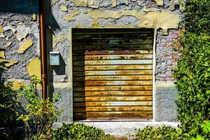 Old closed and rusty garage shutter photo