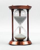 Sand clock concept with hourglass photo