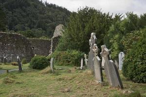 Ruins of a monastic settlement, built in the 6th century in Glendalough, Ireland photo