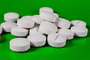 White medical pills and tablets with bottle photo