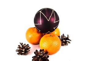 Orange mandarins with christmas baubles isolated on white background photo