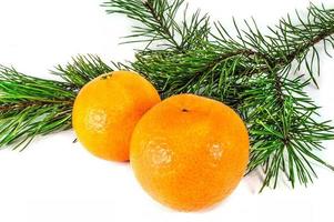 Orange mandarins with christmas baubles isolated on white background photo
