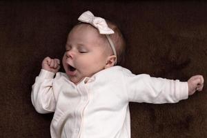 Newborn baby girl boy wants to sleep photo