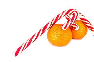 Orange mandarins with christmas baubles isolated on white background photo