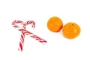 Orange mandarins with christmas baubles isolated on white background photo