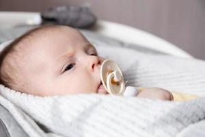 A close-up portrait of a newborn baby girl photo