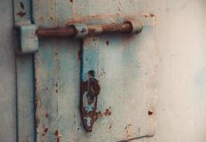 Metal door with bolt in grungy style with copy space