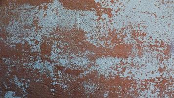 Rusty metal wall old sheet of iron covered with rust with multicolored paint background texture photo