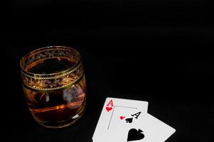 Glass of dark red whiskey brandy or bourbon photo