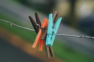wooden clothespin on the rope photo
