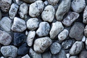 Abstract background with dry round pebble stones photo
